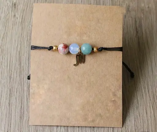 Byzylyk me miks gurësh natyralë dhe simbol të shenjave të zodiakut